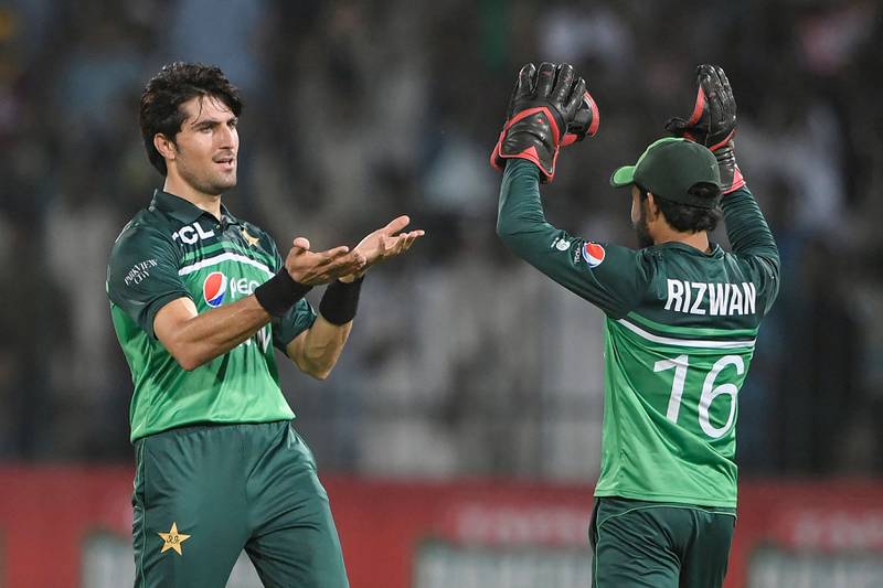 Pakistan's Mohammad Wasim celebrates with wicketkeeper Mohammad Rizwan after taking the wicket of West Indies' Kyle Mayers. AFP