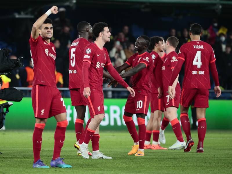 Liverpool players celebrate their 3-2 comeback victory against Villarreal, and a place in the Champions League final. EPA