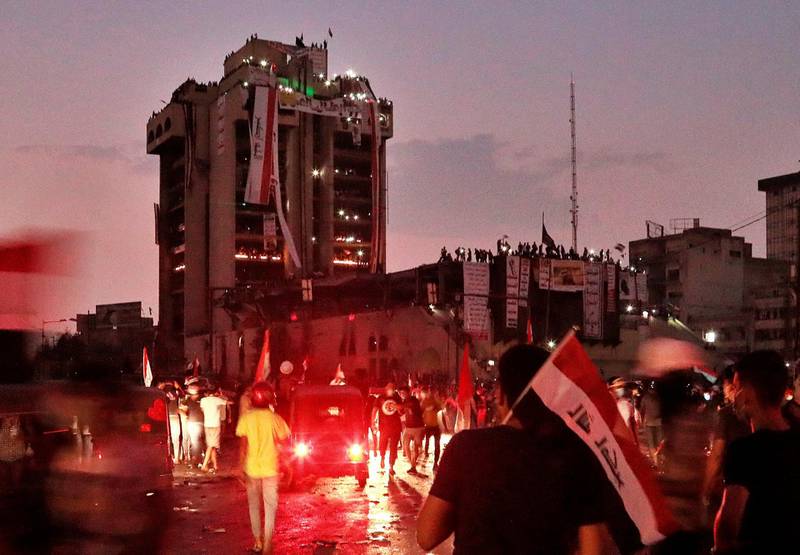 Anti-government protesters gather during a demonstration at sunset in Baghdad, Iraq. AP Photo