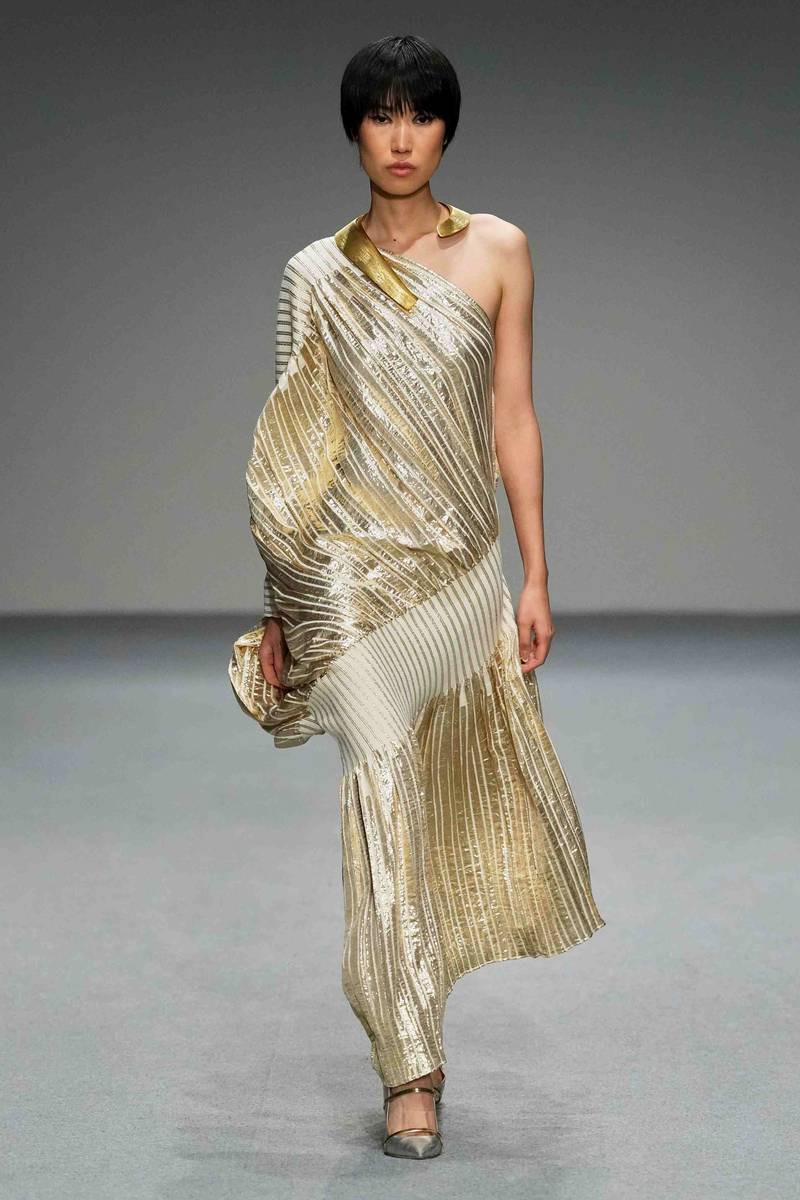 Pale gold plisse dress by Dima Ayad. Photo: Dubai Fashion Week