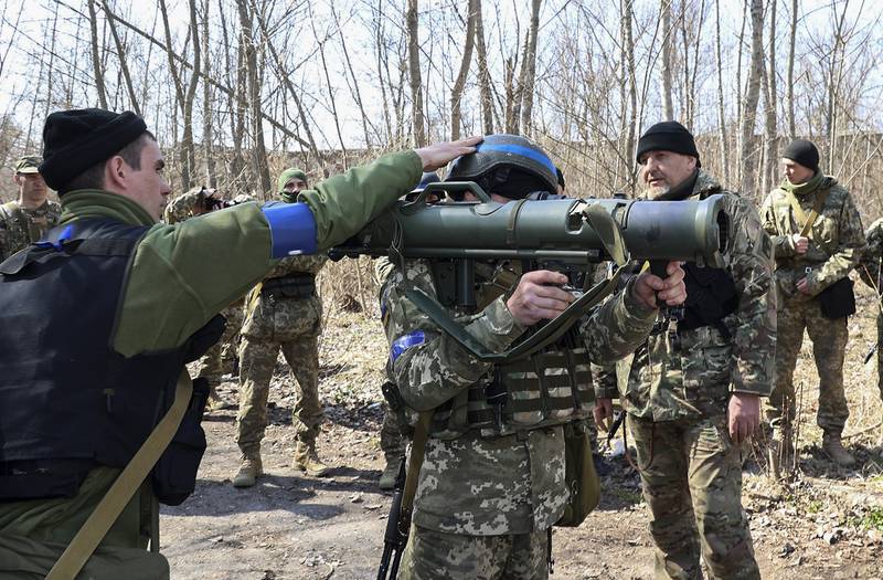 Territorial Defence fighters are trained near Kharkiv. EPA