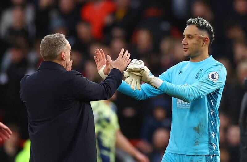 Nottingham Forest manager Steve Cooper celebrates with new goalkeeper Keylor Navas after his debut in the 1-0 Premier League victory against Leeds United at the City Ground on February 5, 2023. Reuters