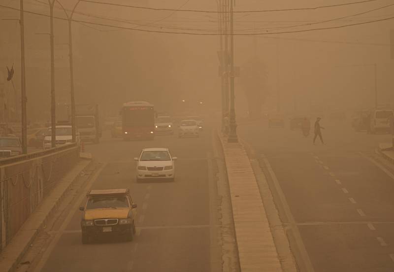 The enveloping orange haze of sand and dust tends to reduce visibility to a few hundred metres. AP