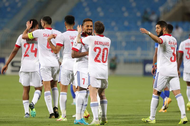 Sharjah's players celebrate their second goal against Hilal to take a 2-0 lead.