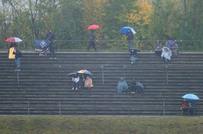 Fans endure the rain at the Nurburgring racetrack. AP