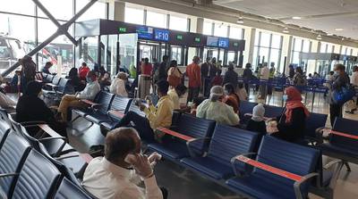 Passengers at Dubai International Airport wait for their flight to Calicut in Kerala. Courtesy: Indian Consulate