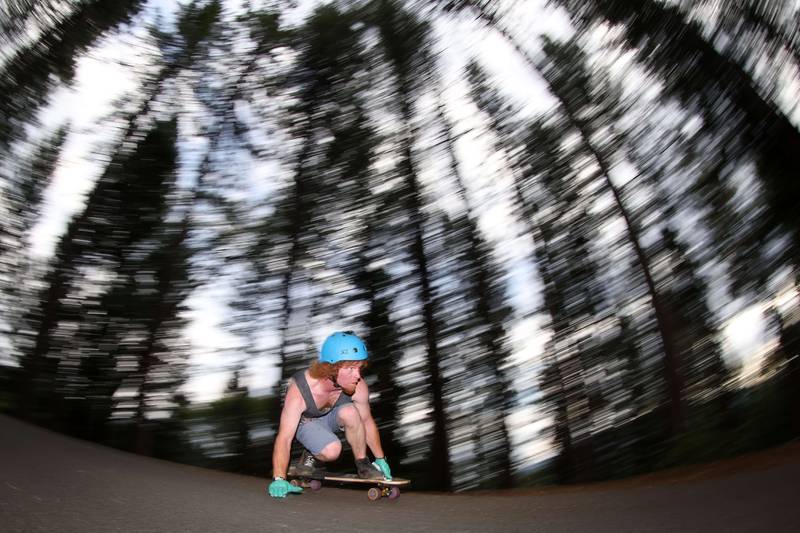 Downhill skateboarders ride modified longboards down hills at extreme speeds routinely between 60-100 kilometres per hour. Getty Images / AFP
