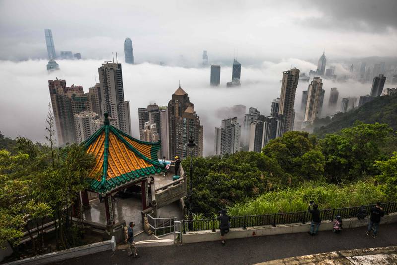 Fog over Hong Kong seen from the Peak viewpoint on March 22, 2022. AFP