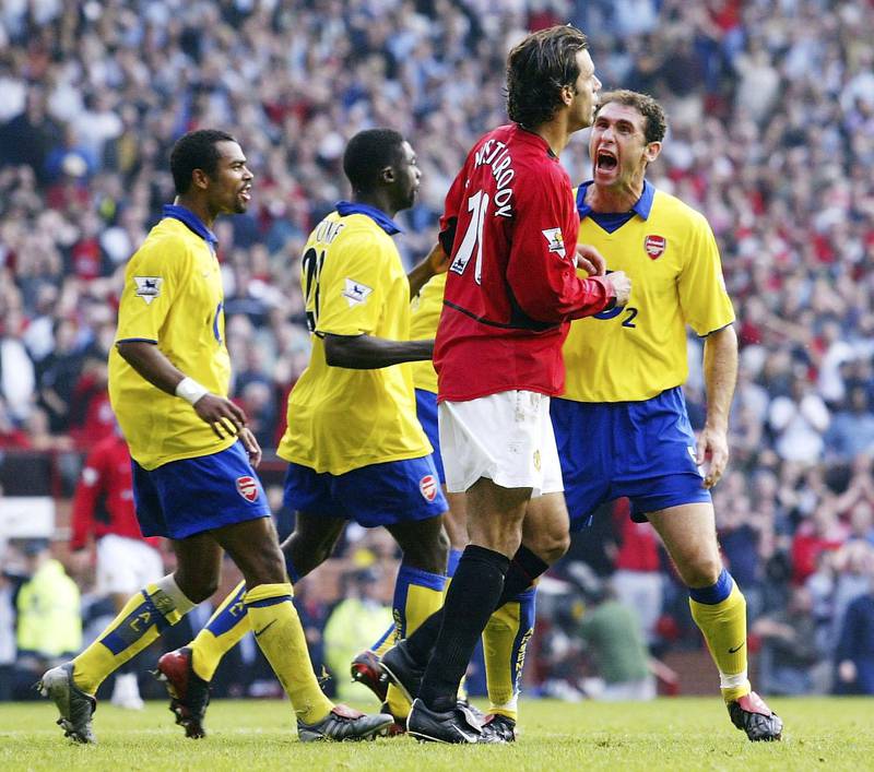 MANCHESTER, ENGLAND - SEPTEMBER 21:  Martin Keown of Arsenal shows his feelings at Ruud Van Nistelrooy of Man Utd after Van Nistelrooy missed his penalty during the FA Barclaycard Premiership match between Manchester United and Arsenal at Old Trafford on September 21, 2003 in Manchester, England. (Photo by Shaun Botterill/Getty Images)