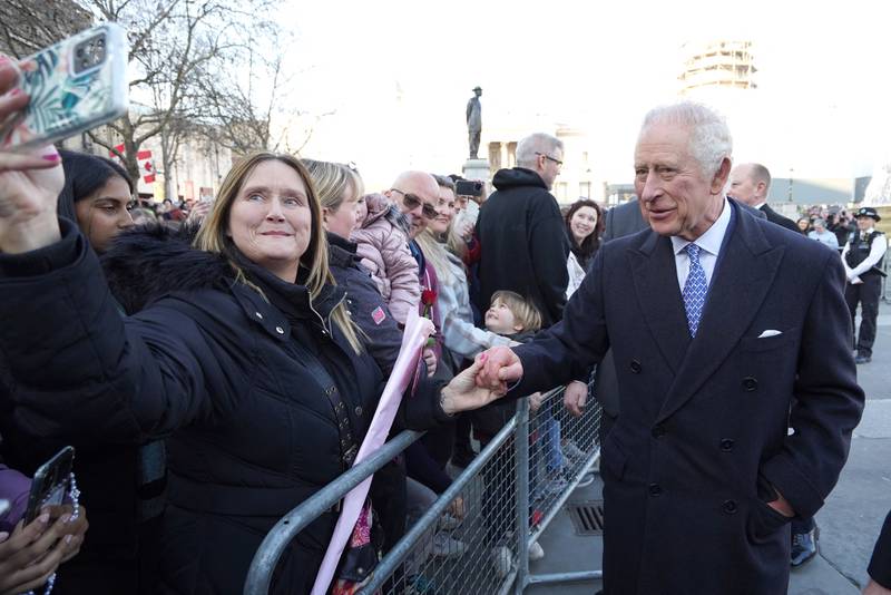 The king meets members of the public. Reuters
