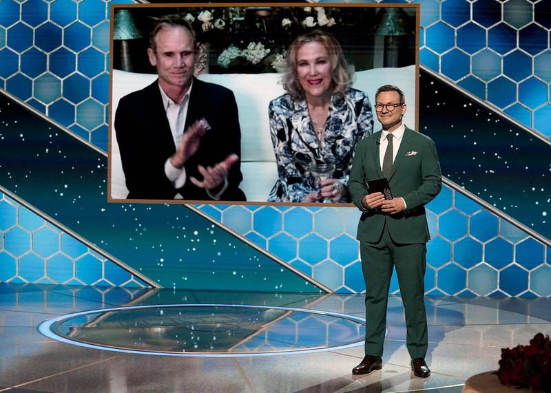 Catherine O'Hara with her husband Bo Welch accepts Best Television Actress - Musical/Comedy Series award for 'Schitt's Creek' via video from Christian Slater onstage at the 78th Annual Golden Globe Awards. AFP / NBCUniversal