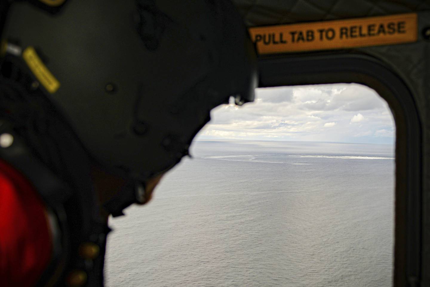 The crew of a Danish military helicopter monitors the Baltic Sea gas leak. AP 
