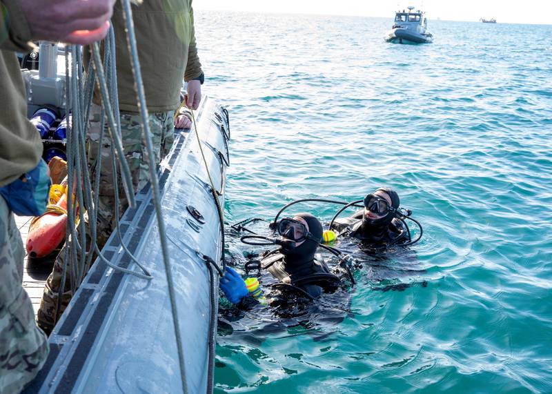 US Navy frogmen recover debris from the Atlantic Ocean. Reuters