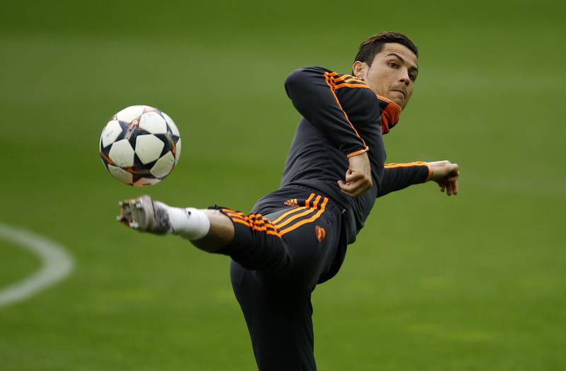 Real Madrid's Cristiano Ronaldo jumps for a ball during a training session in Dortmund. Borussia Dortmund will play Real Madrid in their Champions League quarter-final on Tuesday. Ina Fassbender / Reuters