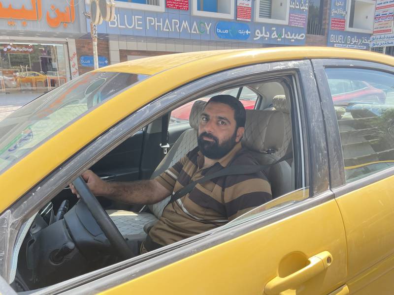 Wissam Mohammed Abbas, a taxi driver in Baghdad, says his low income is barely enough to sustain his family's daily needs. Sinan Mahmoud / The National