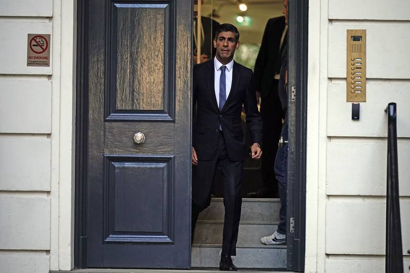 Rishi Sunak departs after making a statement inside the Conservative Party's headquarters. PA