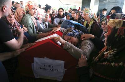 epaselect epa07724955 Relatives of Turkish diplomat Osman Kose cries on his coffin during his funeral ceremony in Ankara, Turkey, 18 July 2019. Turkish consulate employee  Osman Kose was killed when gunmen opened fire at the restaurant where Turkish diplomats were present on 17 July in Erbil, Iraq.  EPA/STR