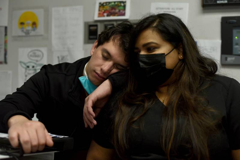 Gabriel Cervera and Sanjana Krishnan take a break from treating patients infected with the coronavirus disease at United Memorial Medical Center in Houston, Texas, U.S. Reuters
