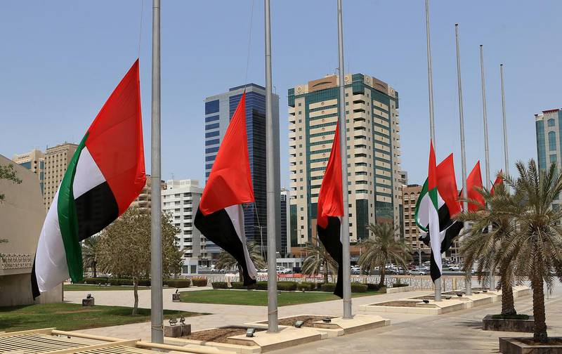Flags fly at half-mast at Abu Dhabi Municipality as the UAE declares a three day mourning following the death of 45 Emirati soldiers in Yemen. Ravindranath K / The National