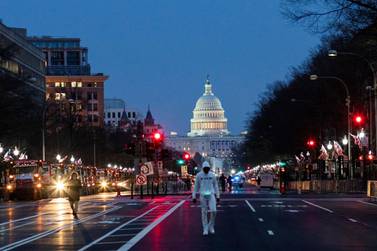 People make their way near the capitol ahead of U.S. President-elect Joe Biden's inauguration, in Washington, U.S., January 15, 2021. REUTERS/Eduardo Munoz