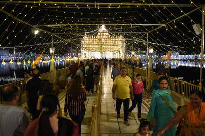 Devotees visit the illuminated Durgiana Temple in Amritsar. AFP