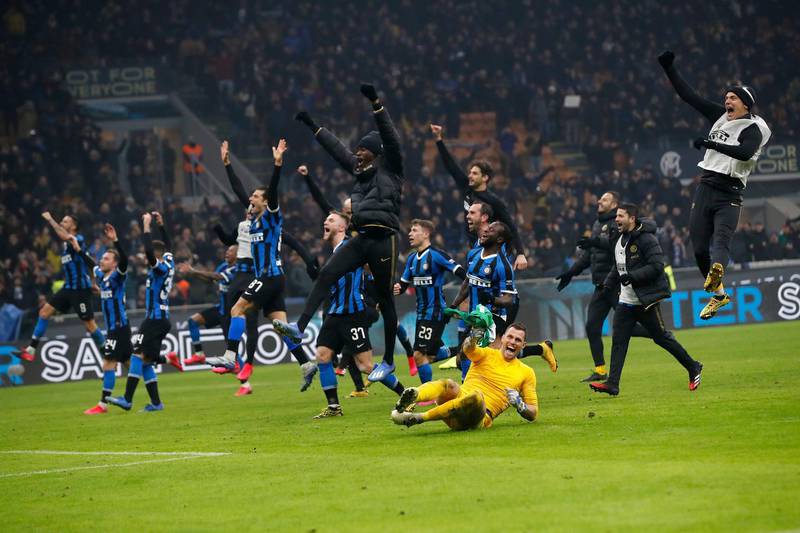 Inter Milan players celebrate after winning the derby match. AP