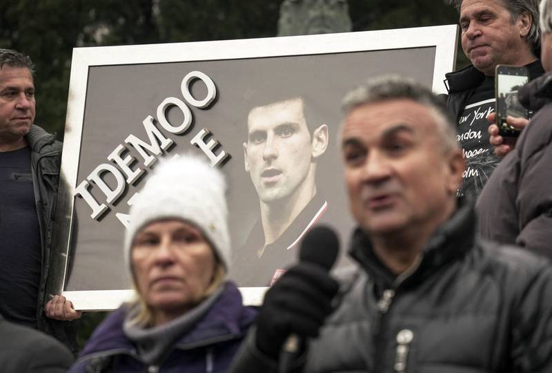 Serbian tennis player Novak Djokovic's father Srdjan Djokovic (R) speaks flanked by his wife Dijana Djokovic (L), as they take part in a rally in front of Serbia's National Assembly, in Belgrade. AFP