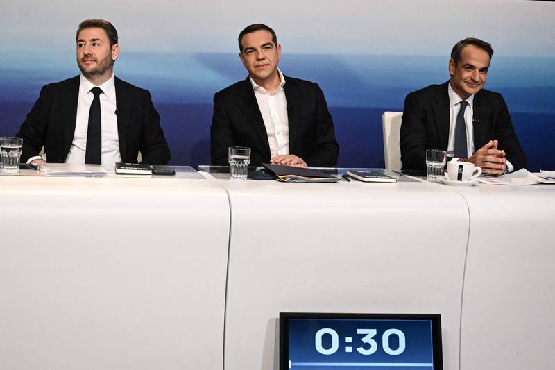 The centre-right New Democracy party of Greek Prime Minister Kyriakos Mitsotakis, right, is currently ahead of the main opposition Syriza party led by former prime minister Alexis Tsipras, centre. But Mr Mitsotakis may have to mend ties with socialist Pasok leader Nikos Androulakis, left, to forge a governing coalition. AFP