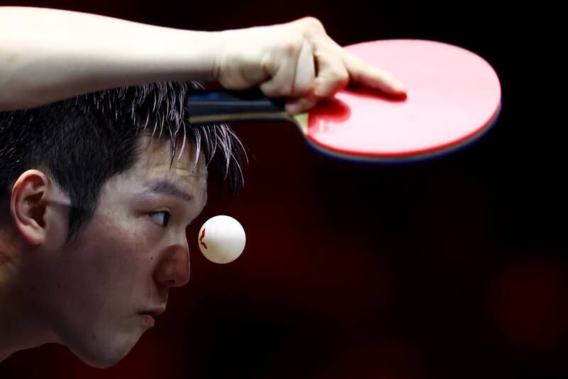 Fan Zhendong of China, ITTF men's world No 1, serves against compatriot Wang Chuqin in their men's singles semifinal during the WTT Singapore Smash at the OCBC Arena in Singapore. Getty