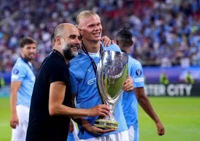 Manchester City's Erling Haaland and manager Pep Guardiola after winning the Super Cup in Greece. PA