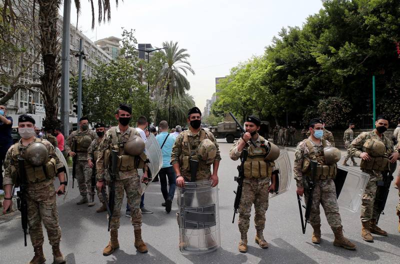 Lebanese soldiers guard the site where anti-government protesters gather to support Ghassan Oueidat, the country’s top prosecutor, in his public spat with Judge Ghada Aoun, the chief prosecutor for the region of Mount Lebanon, on the road leading to the Palace of Justice in Beirut, Lebanon. EPA