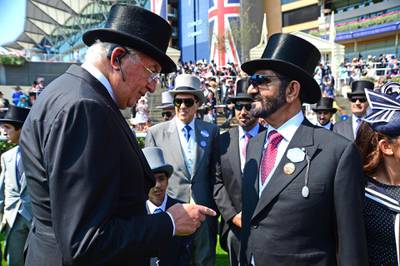 Mandatory Credit: Photo by Pat Healy/Racing Fotos/Shutterstock (8873575r)
ROYAL ASCOT. THE ST JAMES'S PALCE STAKES. Godolphin owner SHEIKH MOHAMMED is congratulated by Coolmore owner, JOHN MAGNIER after BARNEY ROY won.
Royal Ascot, Day One, UK - 20 Jun 2017