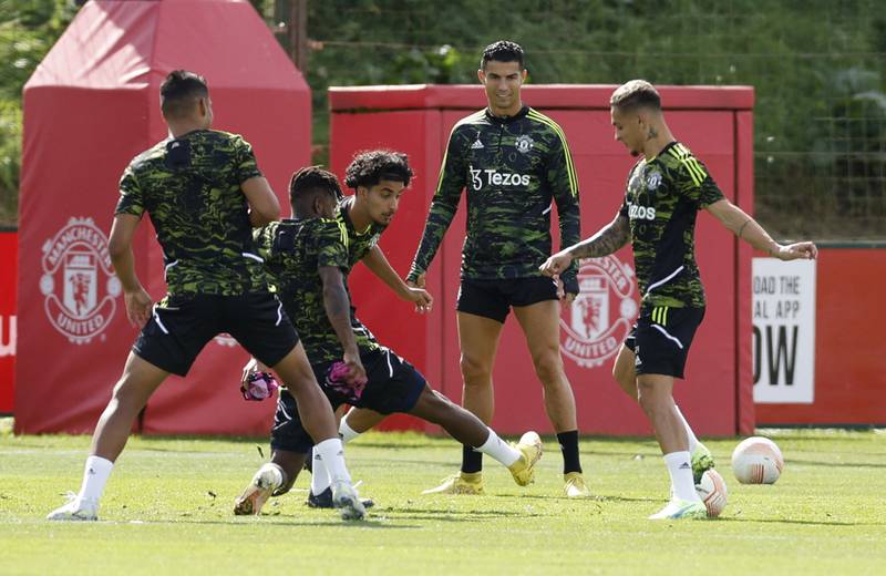 Manchester United's Cristiano Ronaldo and new signing Antony train with teammates at Carrington. Reuters
