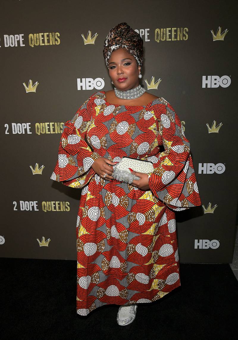 Lizzo in a vibrant dress and silk head scarf in Los Angeles, California, in 2018. Getty Images