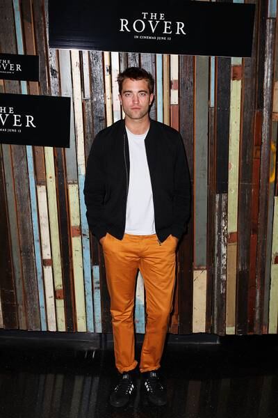 Getting bold in a black bomber jacket and orange trousers at 'The Rover' photocall during the Sydney Film Festival on June 6, 2014. Getty Images