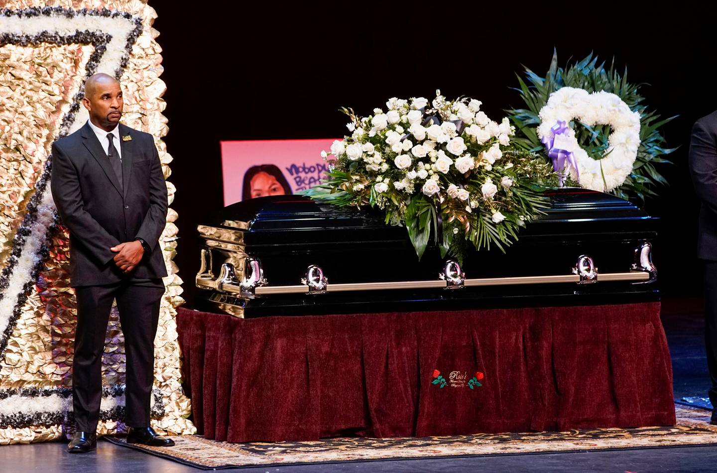 A man stands guard next to the casket for late rapper Marcel Theo Hall, known by his stage name Biz Markie, during the funeral service in Patchogue, New York, on August 2, 2021. Reuters