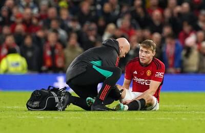 Manchester United's Rasmus Hojlund receives treatment for an injury at Old Trafford. PA