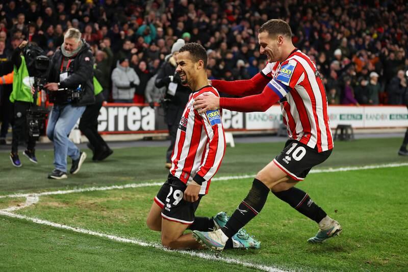 Iliman Ndiaye of Sheffield United celebrates with teammate Billy Sharp after scoring. Getty Images