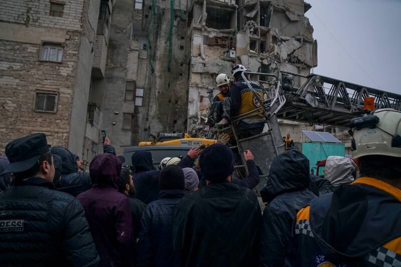 A Syrian Civil Defence team recovering victims of the earthquake in Idlib. Moawia Atrash for The National