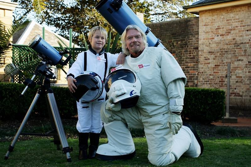 Sir Richard Branson poses alongside Charlie Graham in 2011 in Sydney, Australia. The tycoon announced a competition that would offer the winner a trip to space aboard a Virgin Galactic space plane.