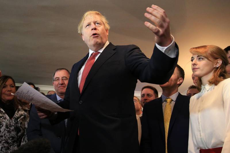 COUNTY DURHAM, ENGLAND - DECEMBER 14: UK Prime Minister Boris Johnson gestures as he speaks to supporters on a visit to meet newly elected Conservative party MP for Sedgefield, Paul Howell at Sedgefield Cricket Club on December 14, 2019 in County Durham, England. Following his Conservative party's general election victory, Prime Minister Boris Johnson called on Britons to put years of bitter divisions over the country's EU membership behind them as he vowed to use his resounding election victory to finally deliver Brexit next month. (Photo by Lindsey Parnaby - WPA Pool/Getty Images)
