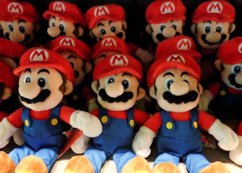 Stuffed Mario toys are displayed at 1Up Factory souvenir shop. Reuters
