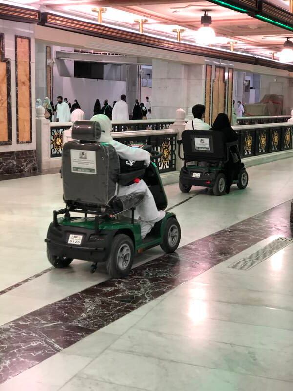 Mobility vehicles ferry pilgrims at the Grand Mosque.