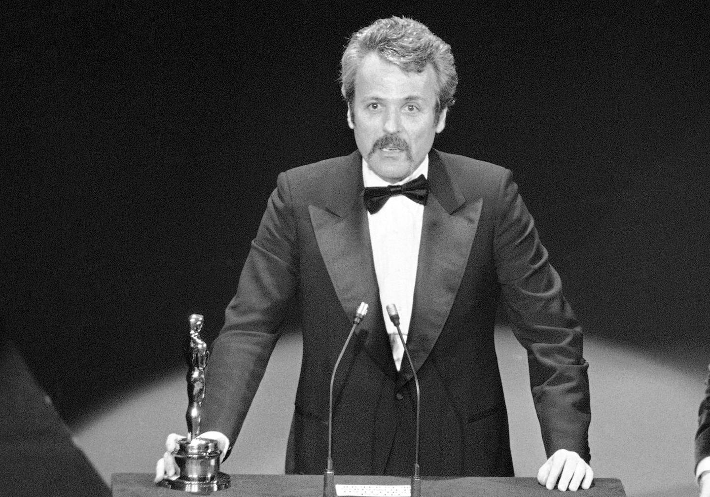 FILE - In this March 28, 1977 file photo, William Goldman accepts his Oscar at Academy Awards in Los Angeles, for screenplay from other medium for "All The President's Men." Goldman, the Oscar-winning screenplay writer of â€œButch Cassidy and the Sundance Kidâ€ and â€œAll the Presidentâ€™s Menâ€ William Goldman died, Friday, Nov. 16, 2018. He was 87. (AP Photo, File)