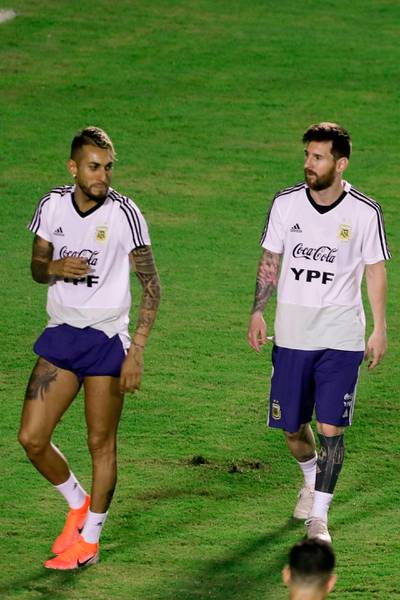 Messi, right, with Watford's Roberto Pereyra. AFP