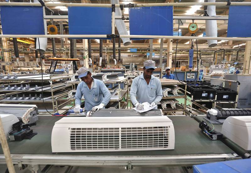 Workers assemble air conditioners inside the Daikin Industries plant in Rajasthan. Adnan Abidi / Reuters