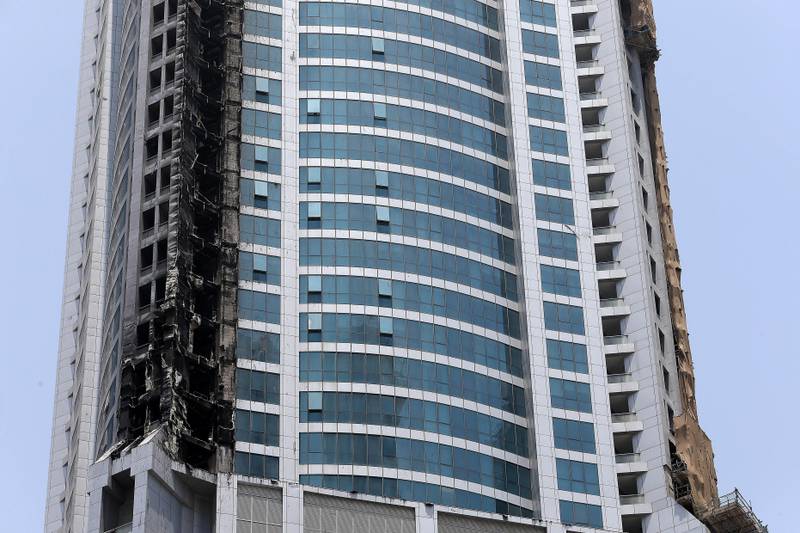 DUBAI , UNITED ARAB EMIRATES , AUG 5 – 2017 :- Damaged portion of the Torch Tower because of fire in the early hours of Friday morning at Dubai Marina in Dubai. ( Pawan Singh / The National ) 