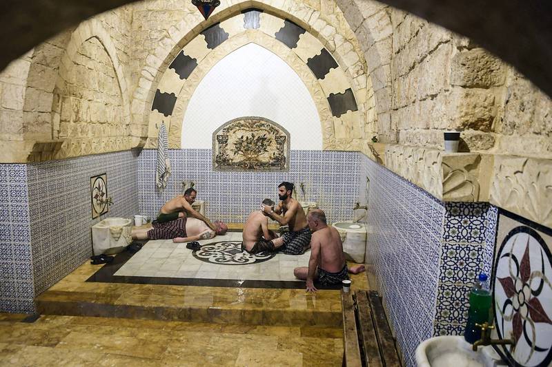 Men gather in the bathhouse in the northern Syrian city.