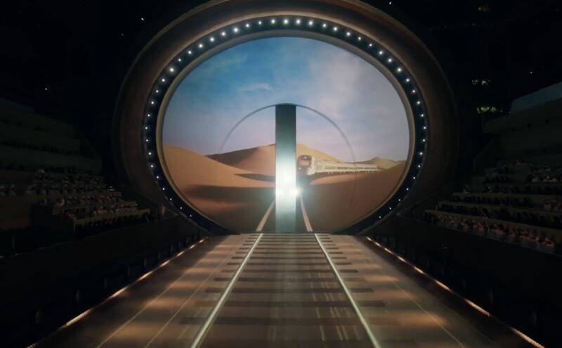 A spectacular time tunnel opened up to welcome an Etihad Rail passenger train. National Day show

