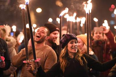 Members of the public take part during the torchlight procession on Edinburgh's Royal Mile for the start of the Hogmanay celebrations. Getty